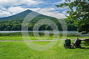 Older Couple Sitting by Abbott Lake Enjoying the View of Sharp Top Mountain